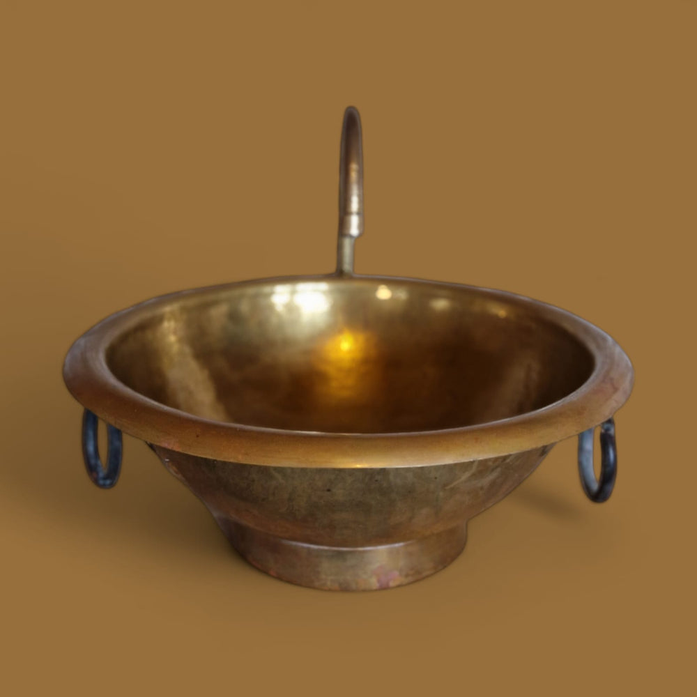 Brass basin with rings.