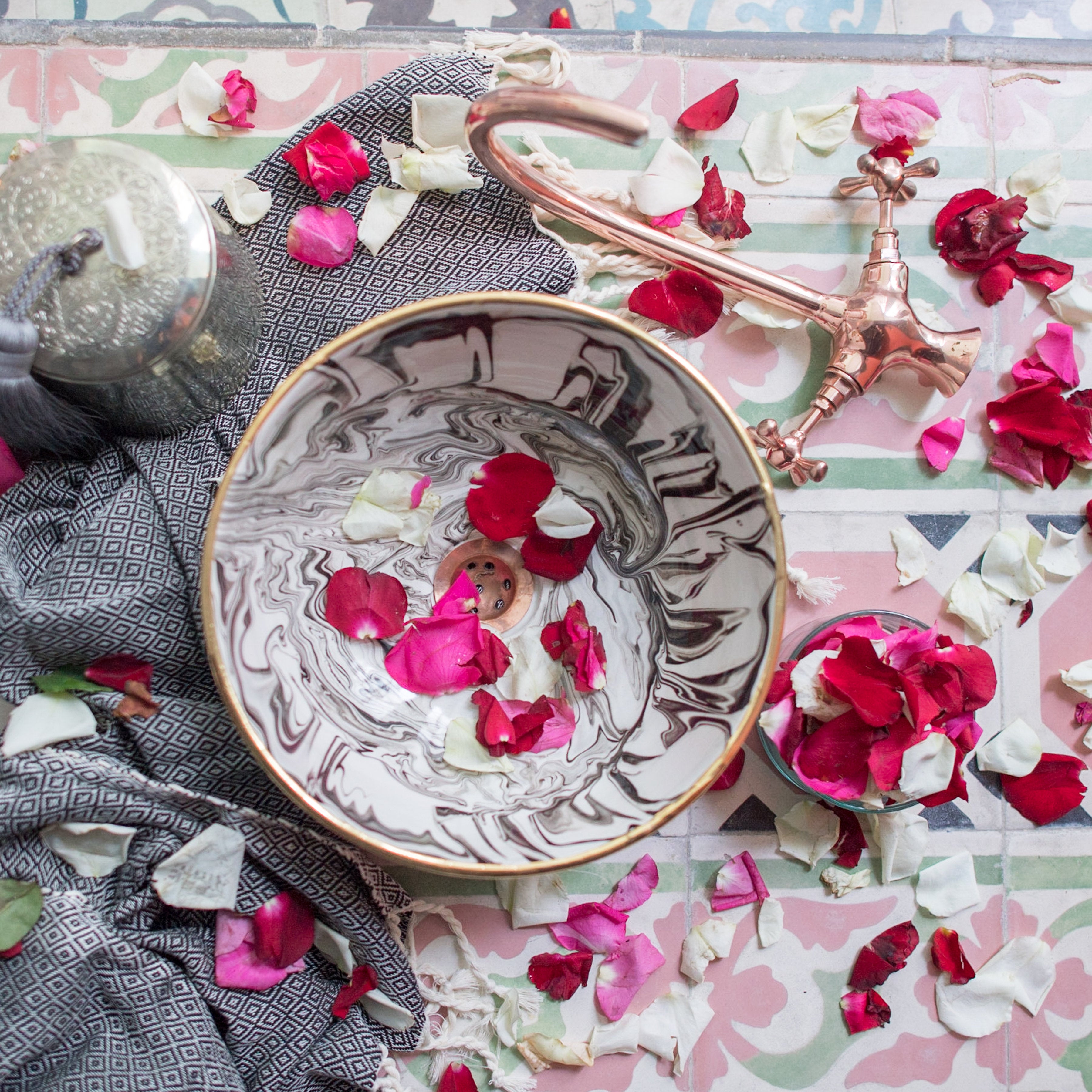 Table setting with rose petals and handmade objects